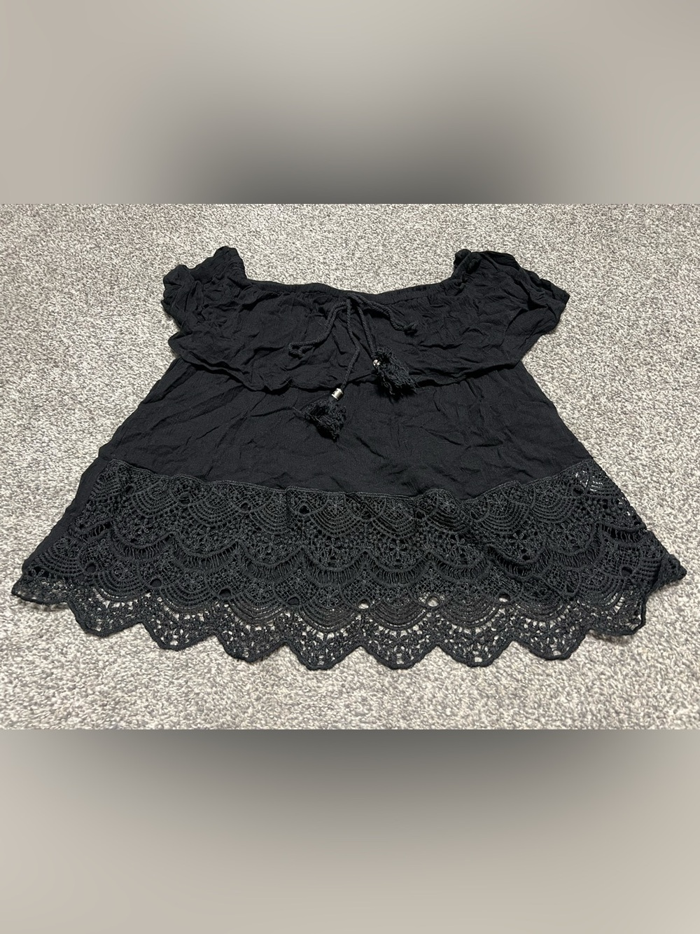 Woman’s Black Off-the-Shoulder Lace Hem Tassel Top